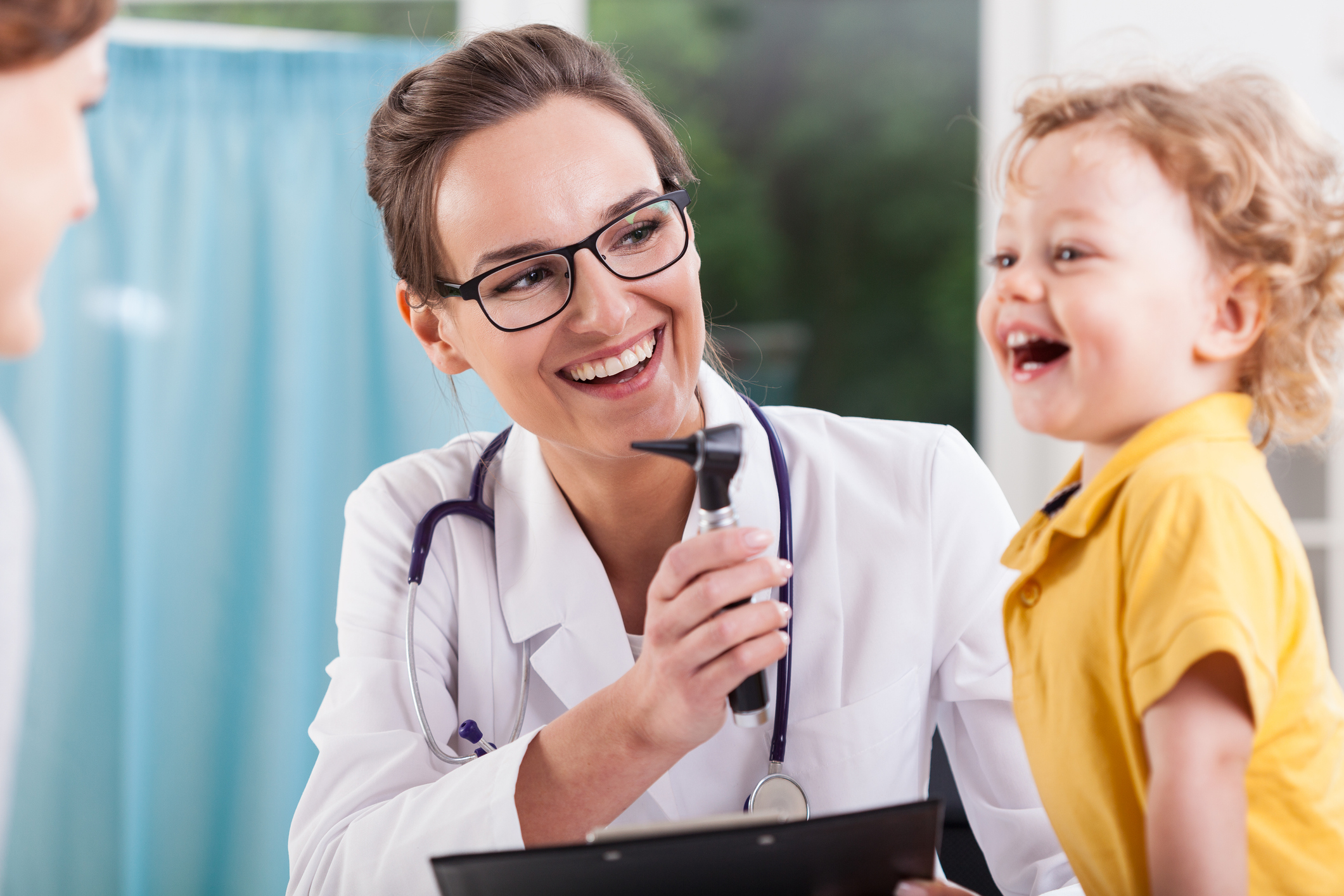 Happy little boy after health exam at doctor's office