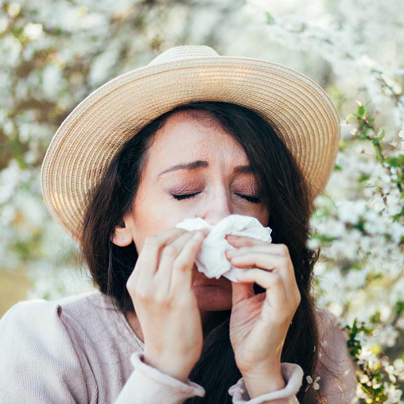 Woman suffering from allergies