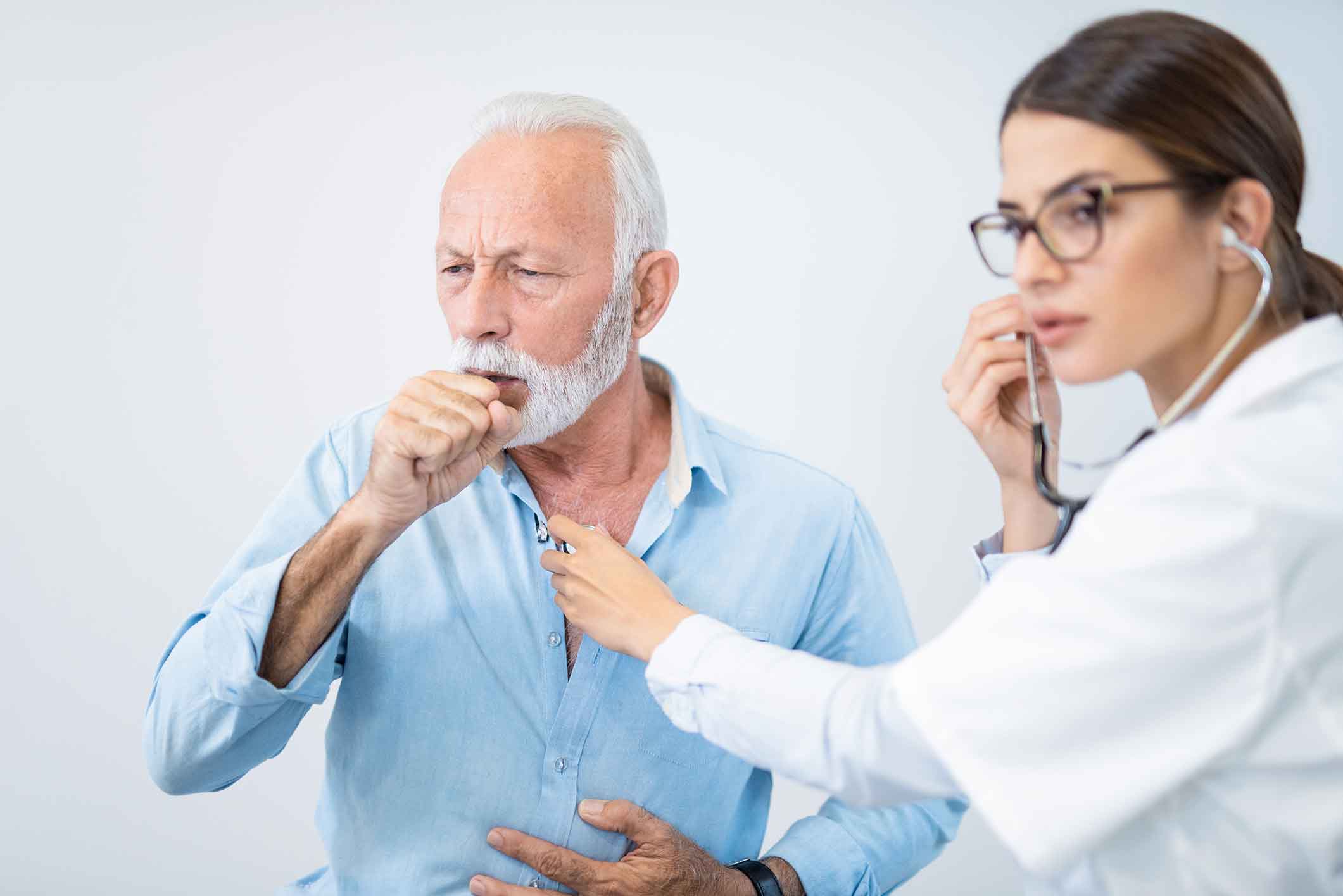 Doctor listening to a man's chronic cough