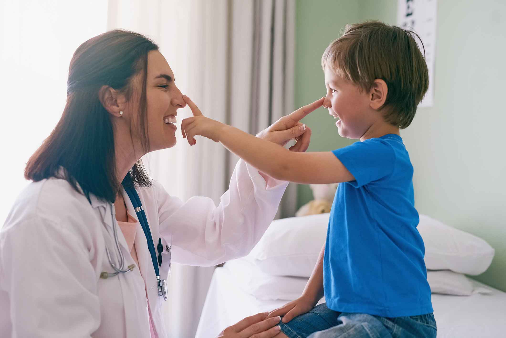 ENT playing with a young patient